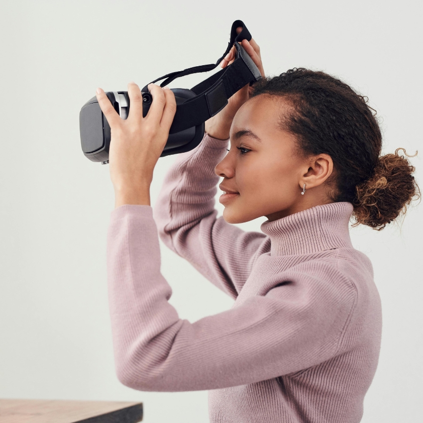 A person preparing to wear a virtual reality headset.