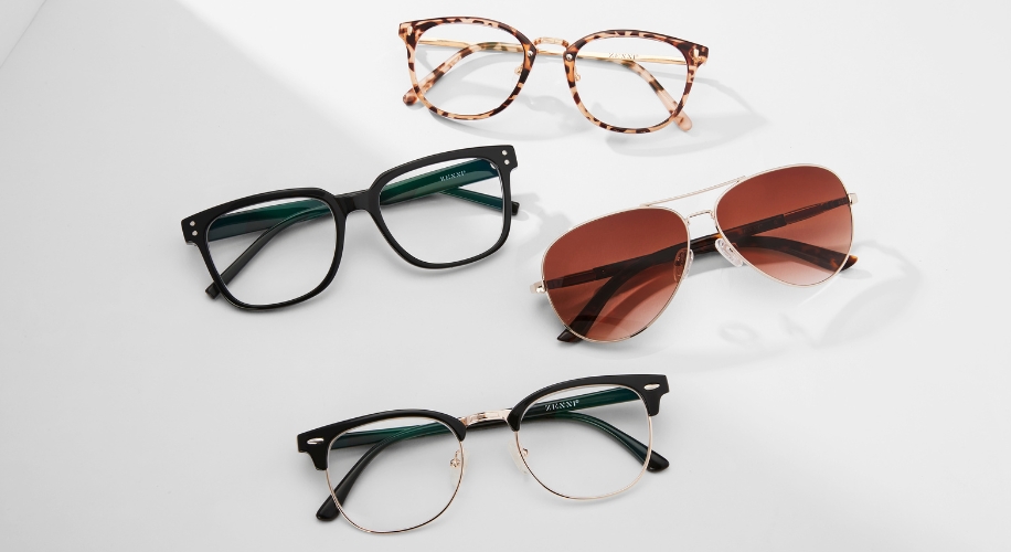 Four pairs of glasses: tortoiseshell, black square, aviator with brown lenses, and black half-rim.