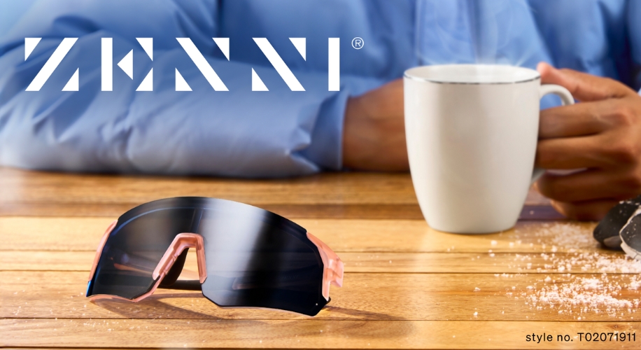 Zenni sunglasses, style no. T02071911, with dark lenses and pink accents on a wooden table.