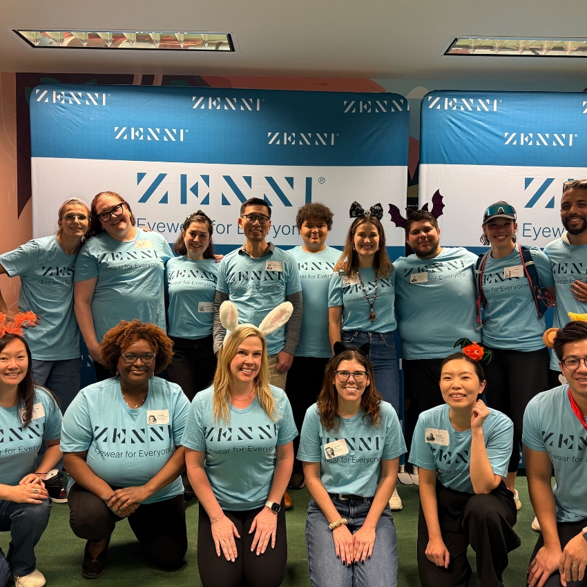 Group wearing teal shirts with "ZENNI Eyewear for Everyone" text.